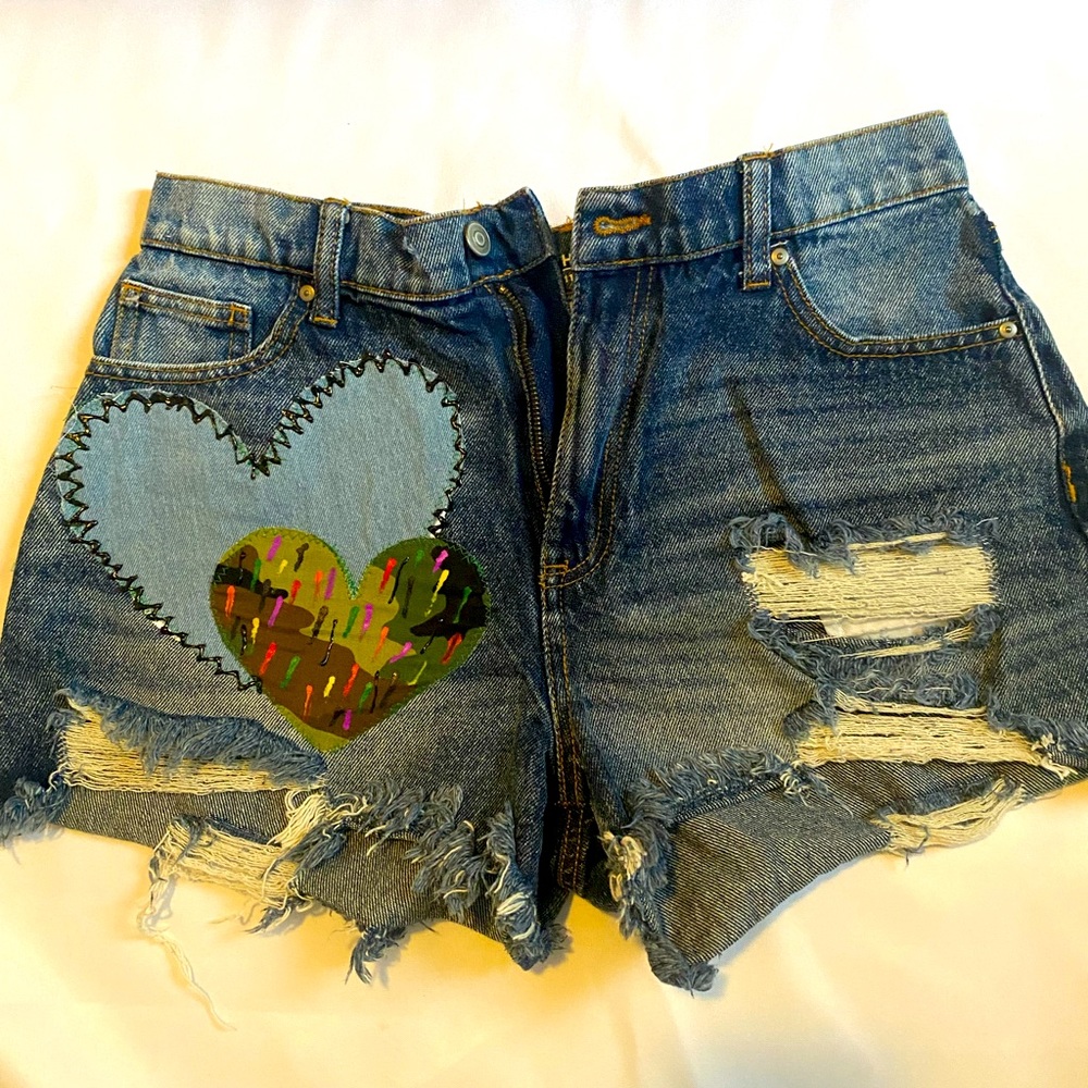 These size 11 No Boundaries Juniors Preowned Upcycle Distress Denim Shorts.